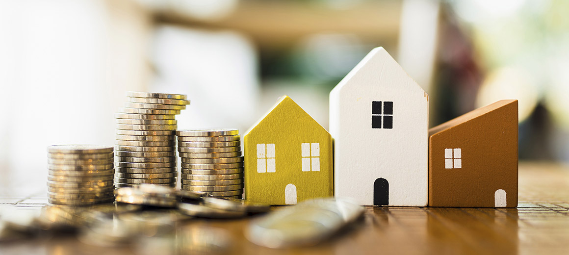 toy house with stacks of gold coins